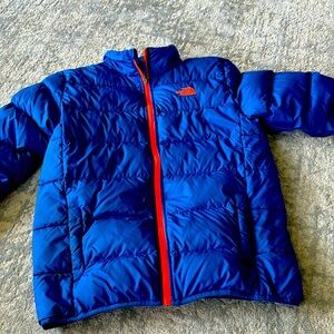 Never worn North face jacket. Kids size XL 18-20 blue with orange trim